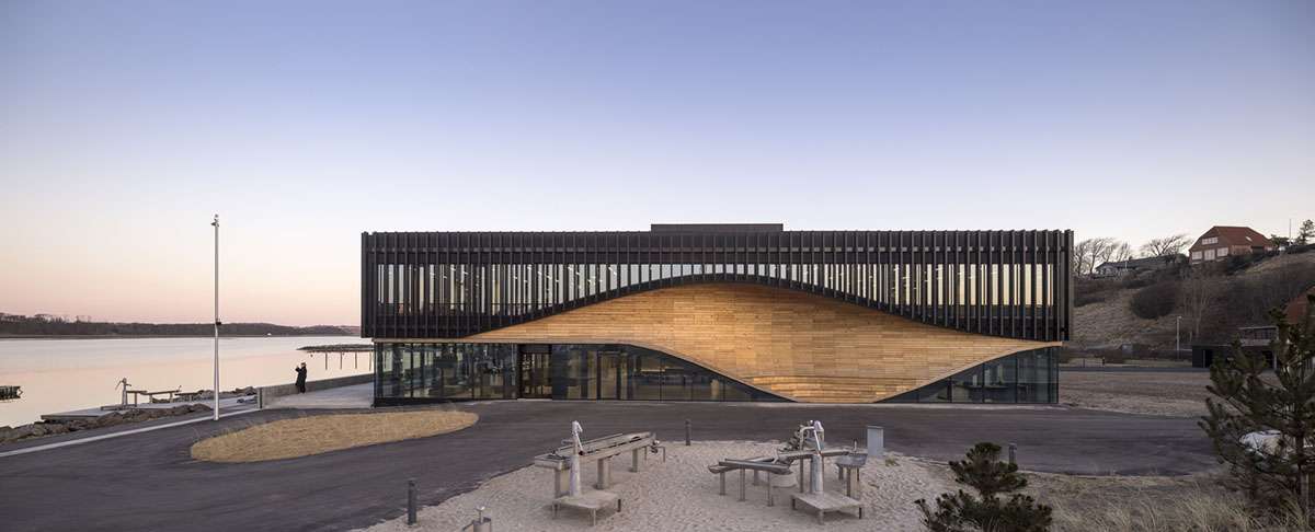 A wooden wave climatium in Denmark to be completed by 3XN Architects and SLA Architects