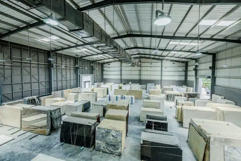 "A warehouse displaying a variety of marble slabs in different colors and patterns"
