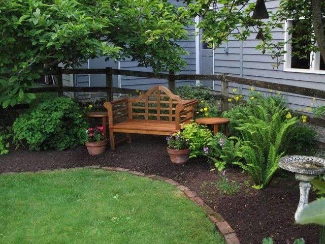 The lawn remains the centerpiece in this yard but was greatly downsized and shaped…