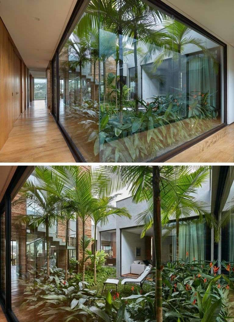 This modern house has an internal garden positioned in the middle of the home,…