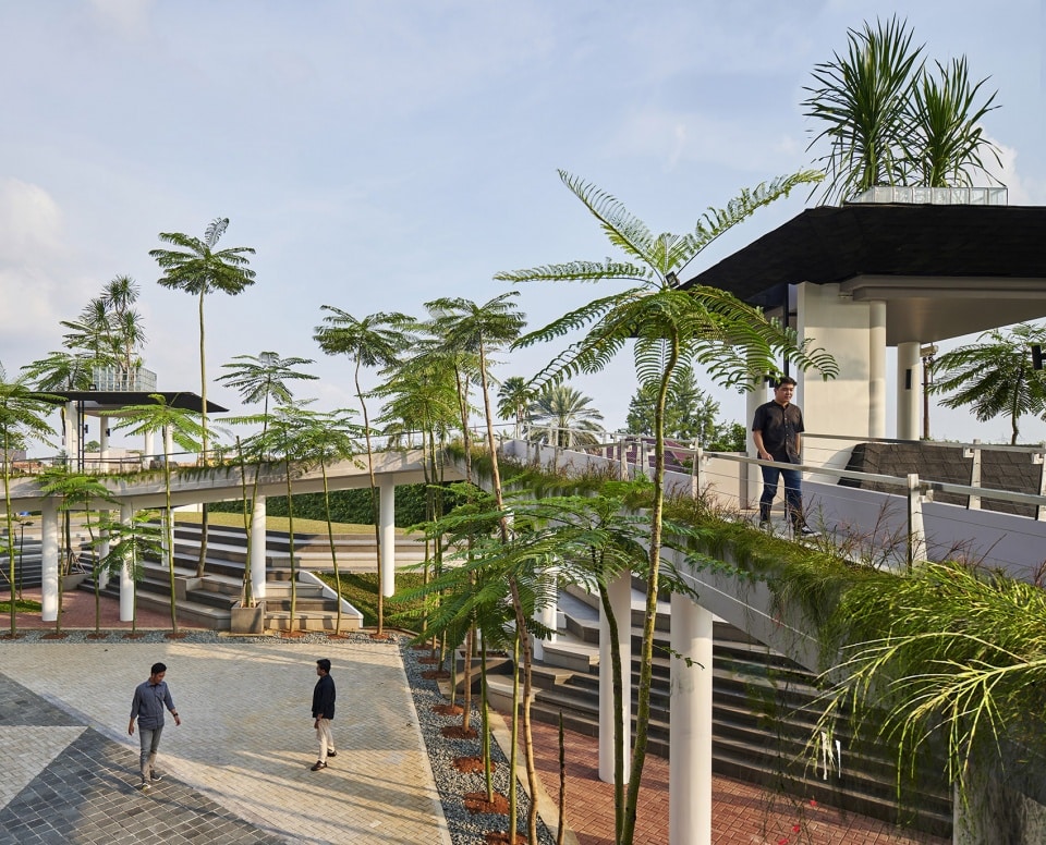 An image showcasing the design of the new plaza at Pamulang University, inspired by the Islamic Star, featuring green spaces and modern buildings.