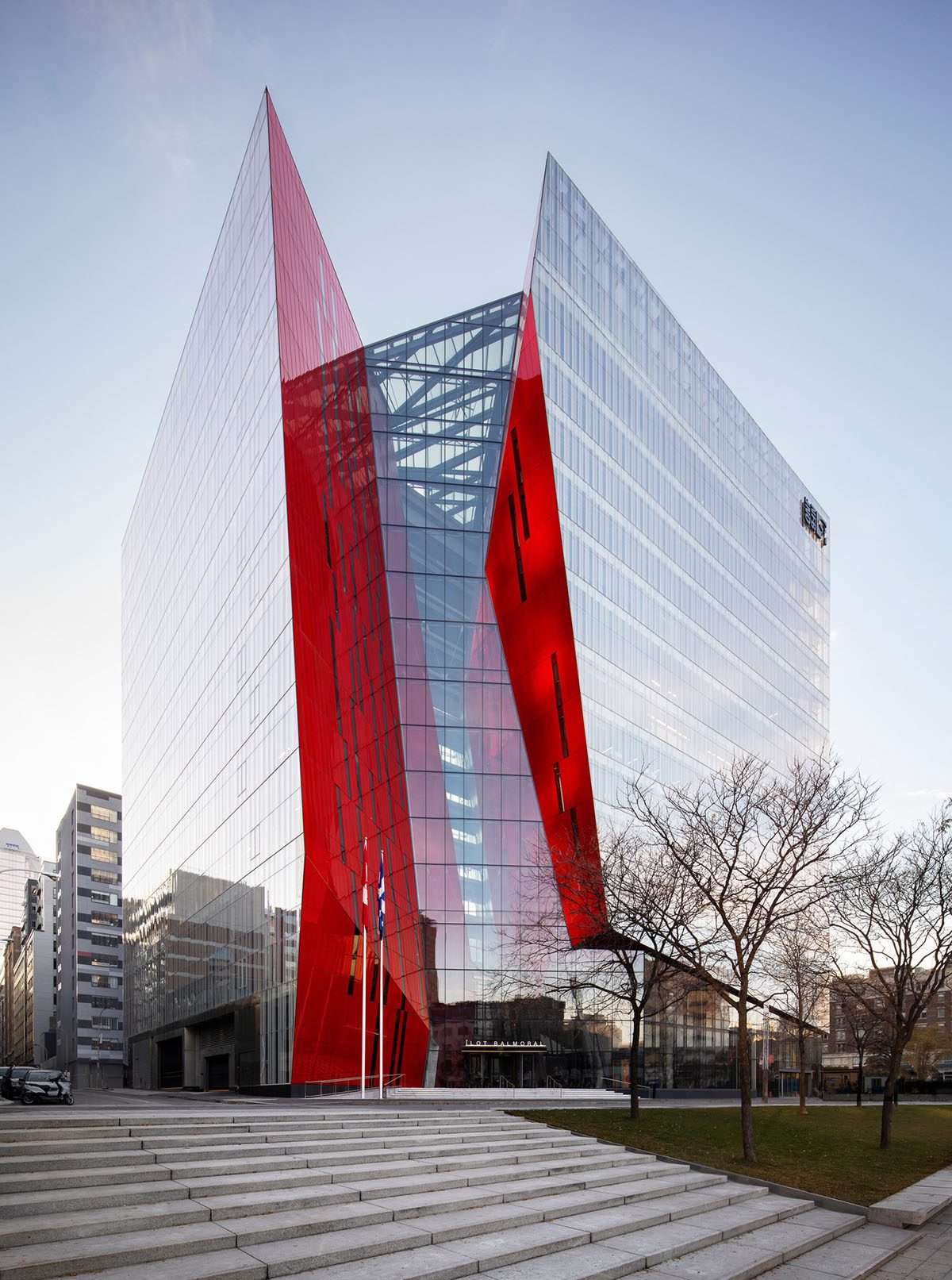 Excavation of a mixed-use office tower with a red diagonal in Montreal