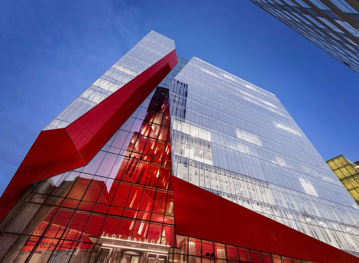 Excavation of a mixed-use office tower with a red diagonal in Montreal