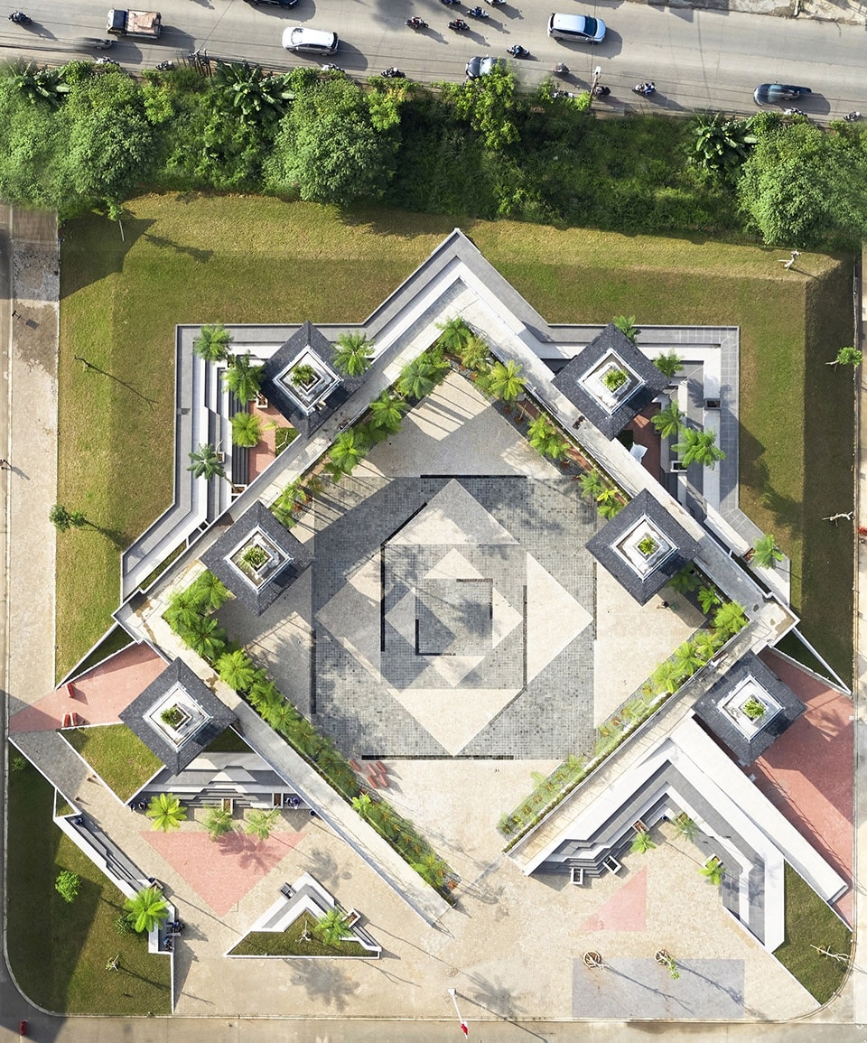 An aerial view of the new plaza at Pamulang University, inspired by the Islamic Star, featuring green spaces and modern buildings.
