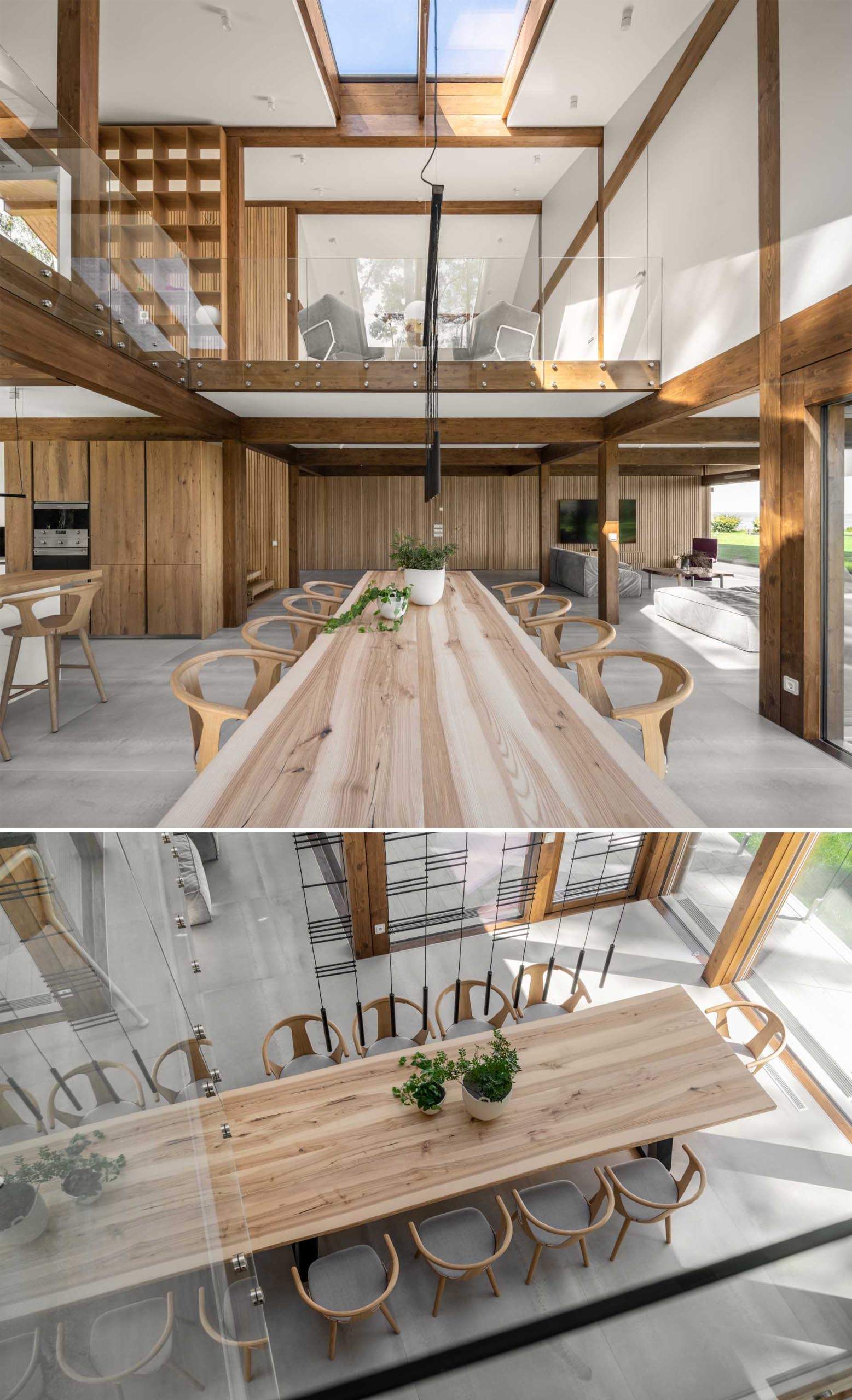 A modern open plan dining area with a large wood table for ten.