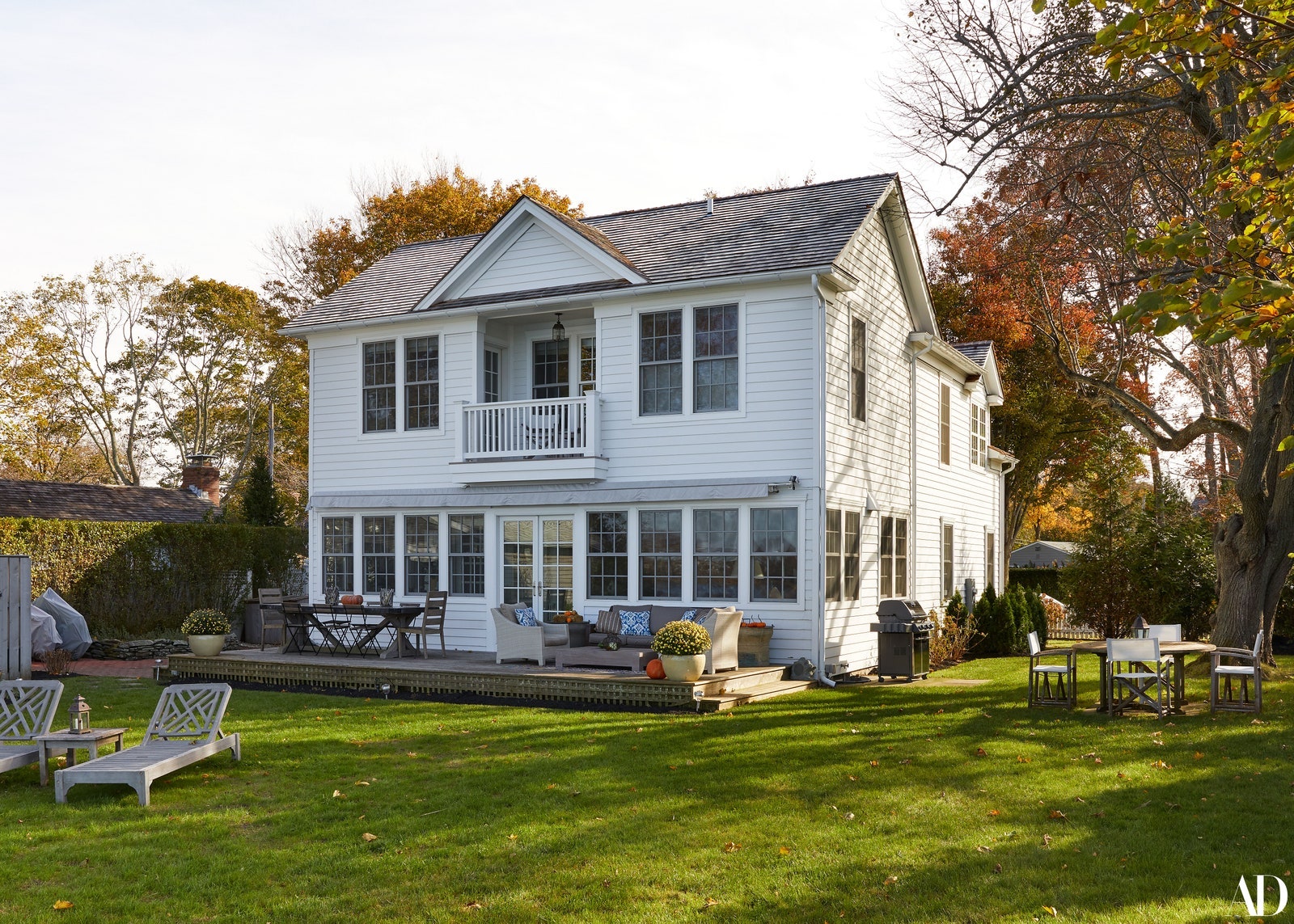 Image may contain Grass Plant Lawn Furniture Bench Housing Building and Roof