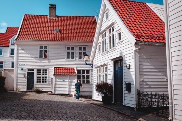 What House Cladding Is and How to Choose the Right Material (5) little village with white cladding houses and red roof - What Is House Cladding