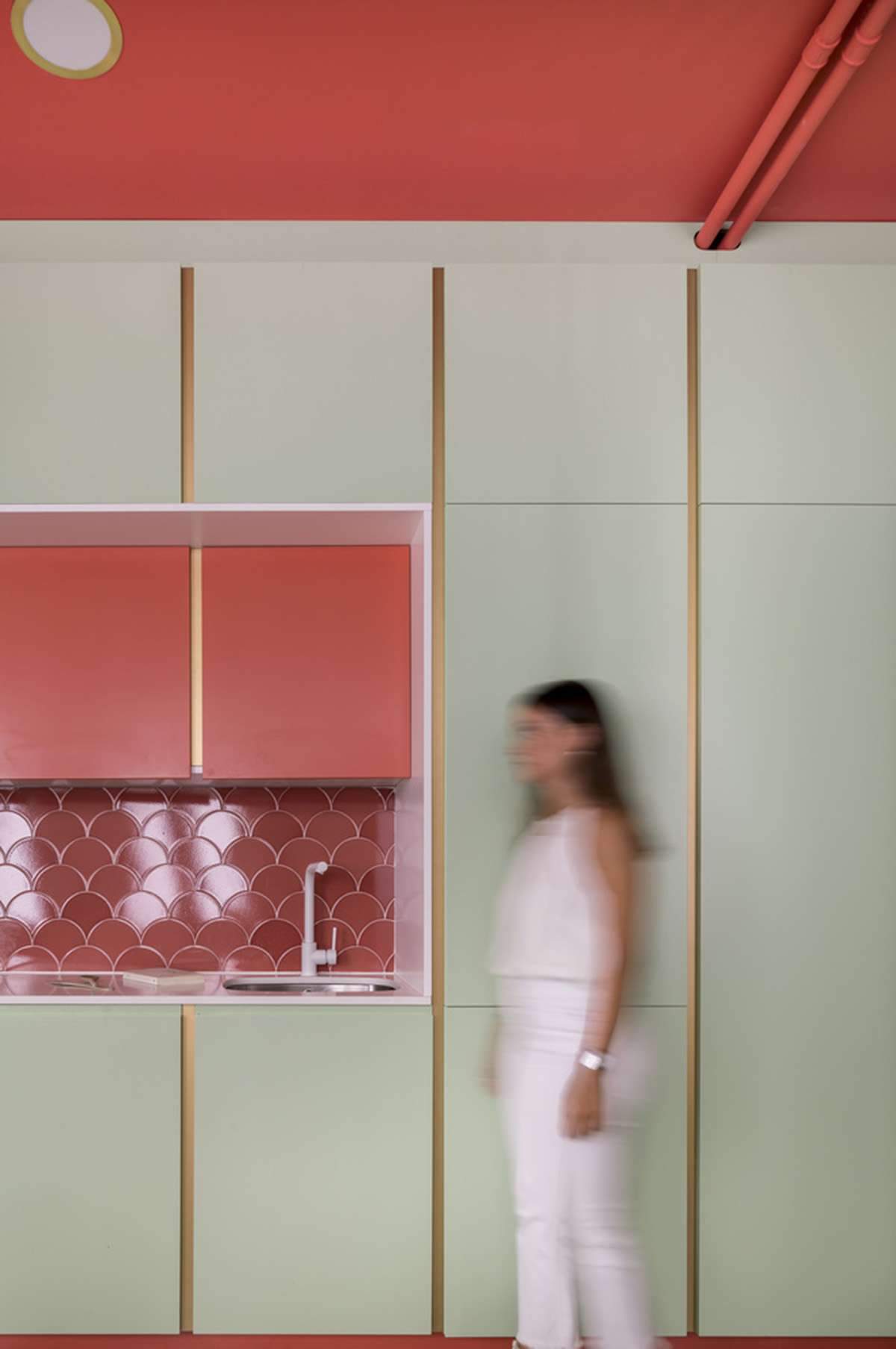 Converting a former store into an apartment with colorful cabinets