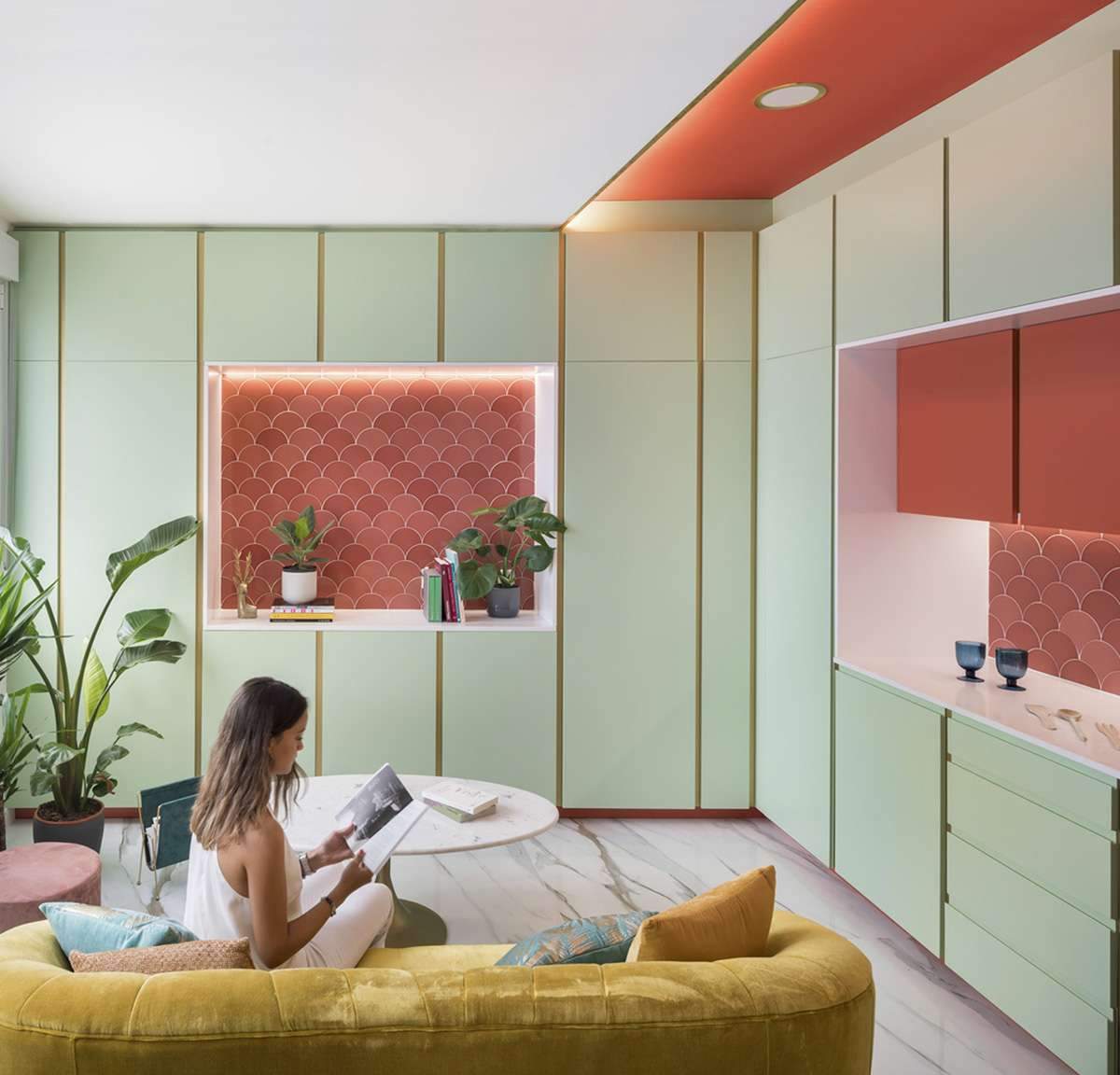 Converting a former store into an apartment with colorful cabinets