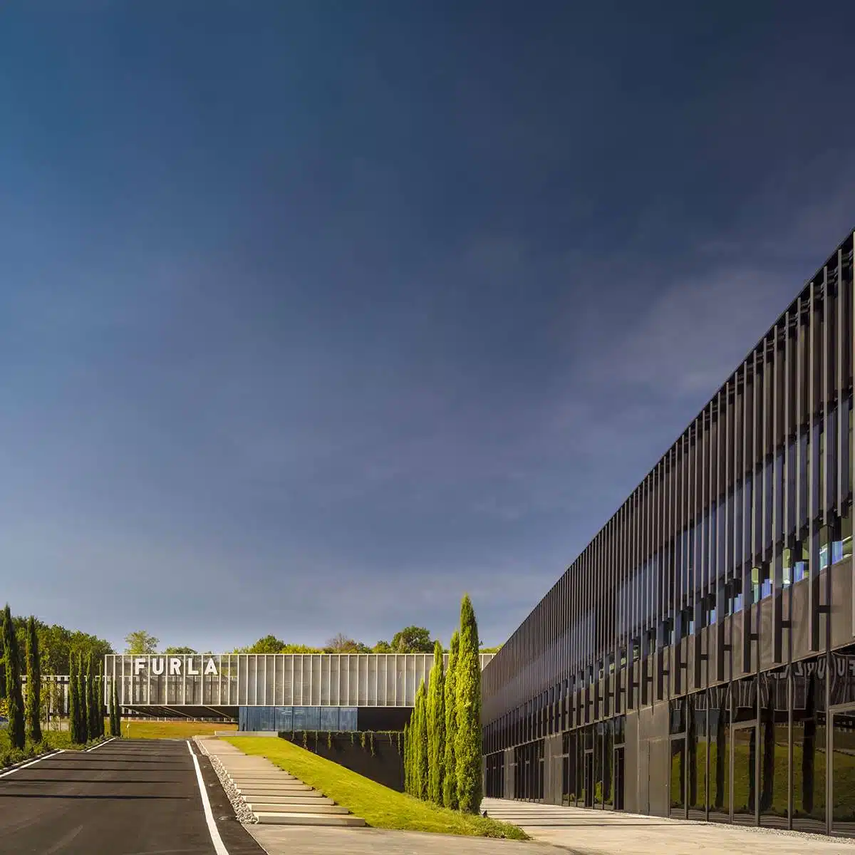 Furla headquarters design with a green stepped roof in the hills of Chianti