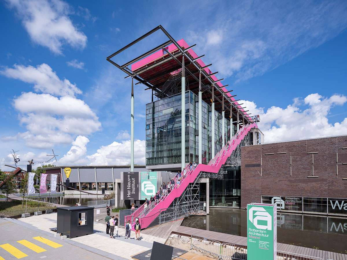 Completing a pink staircase on the roof of the Het Nieuwe Institute