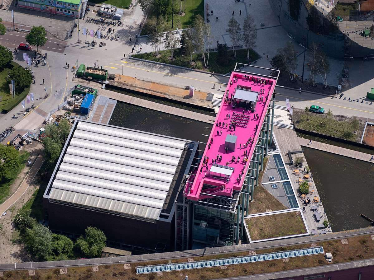 Completing a pink staircase on the roof of the Het Nieuwe Institute