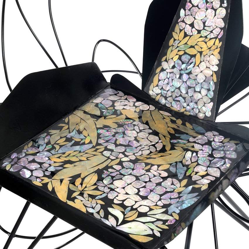 yejoong choi's swirling metal chairs are shaped to evoke butterflies on a river