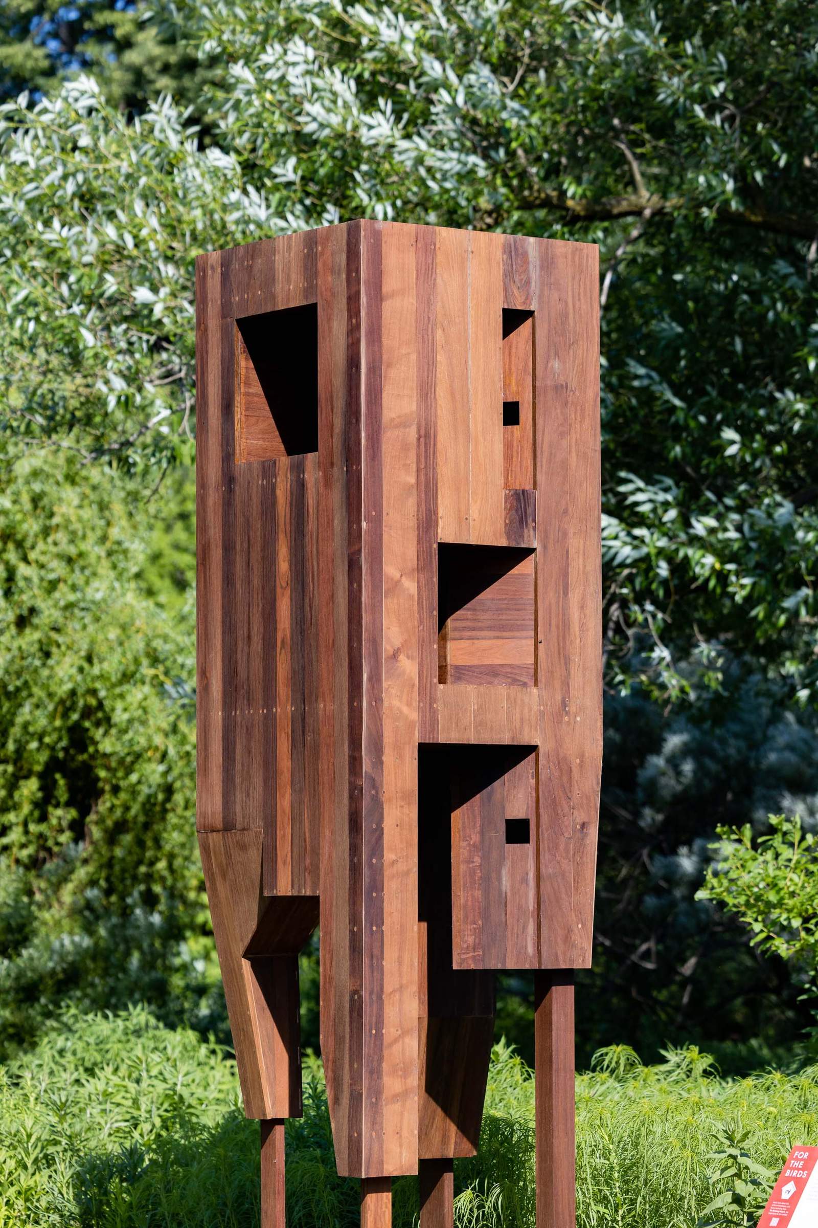 tall wooden birdhouse