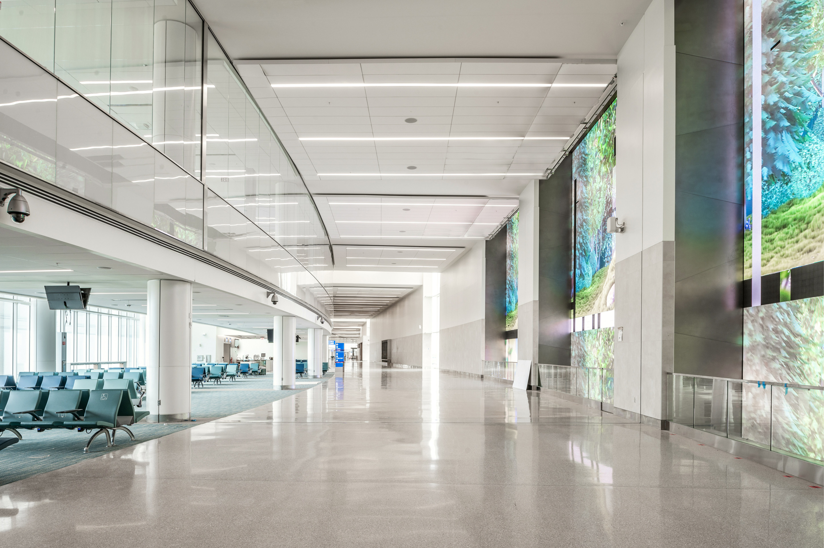 a spacious, skylit airport concourse
