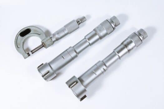 Micrometer on a white background. Vernier depth gauge