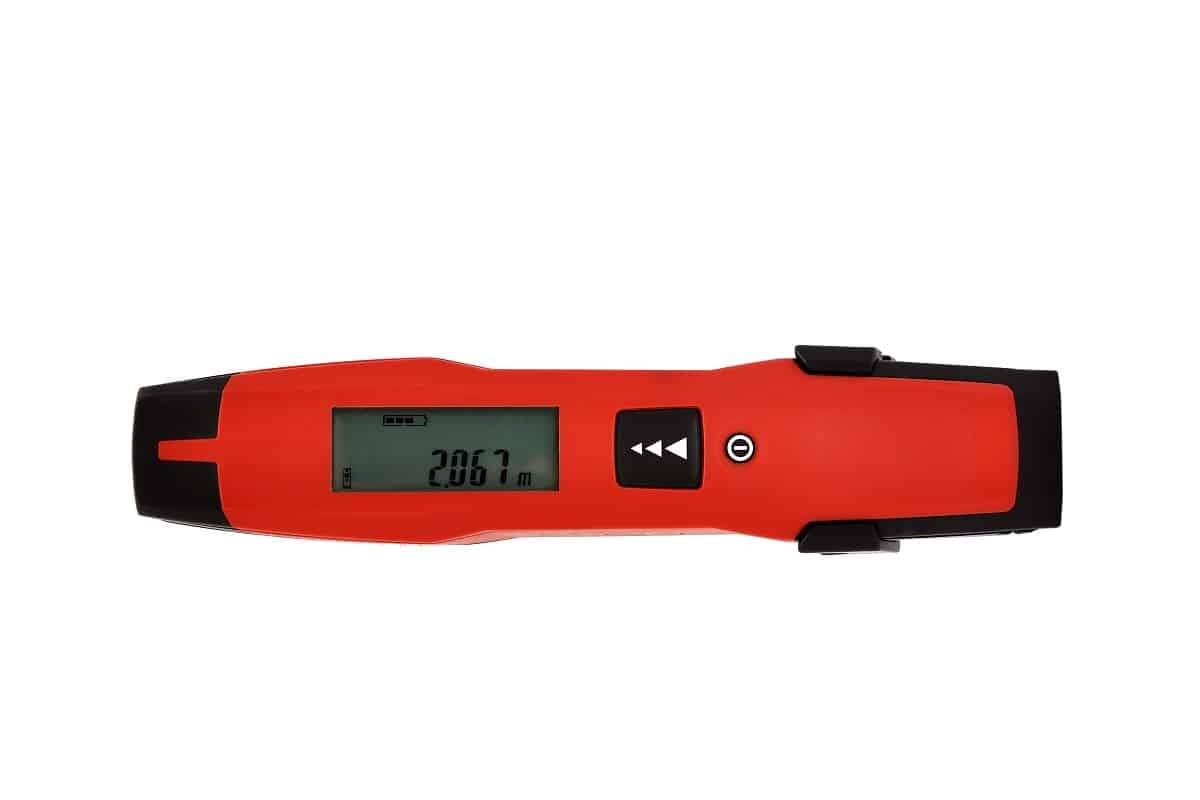 Laser distance meter on white background. Professional use of laser distance measures.