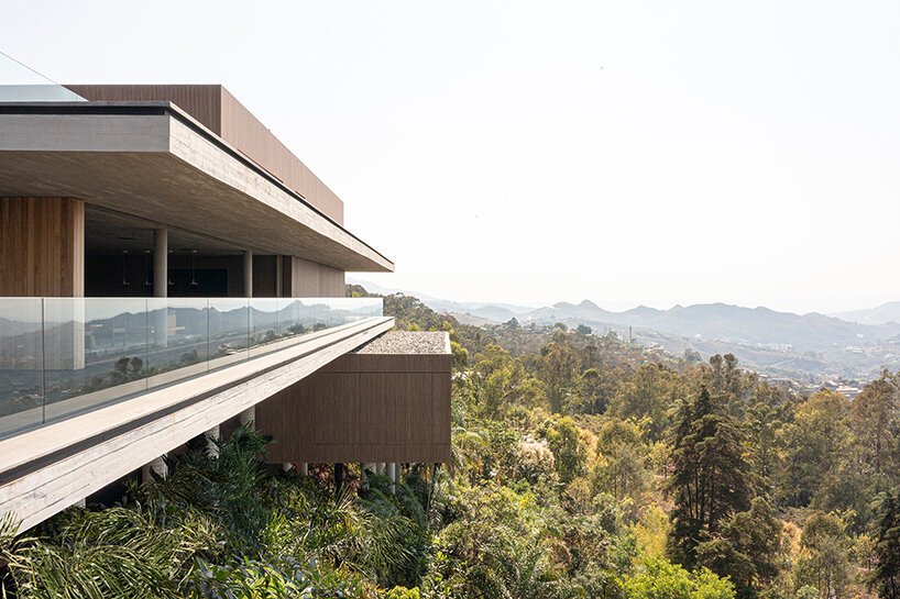 stilted 'minas house' by studio MK27 rests amid a rainforest garden in brazil