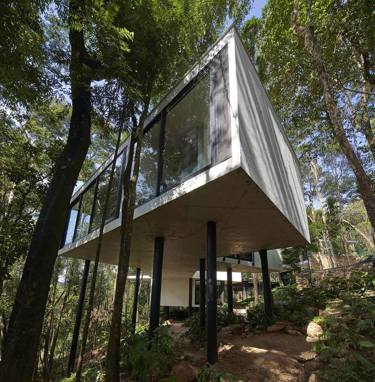 Building a zigzag house high on steel pillars in a Brazilian forest