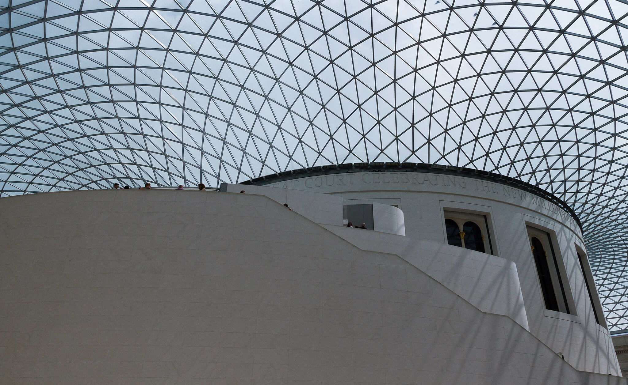 viw of a tessalllated glass roof in a museum court