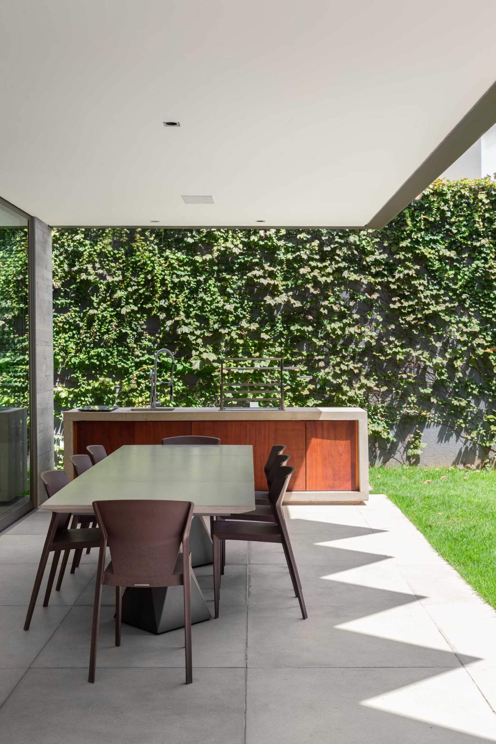 A covered patio for outdoor dining and a kitchen.