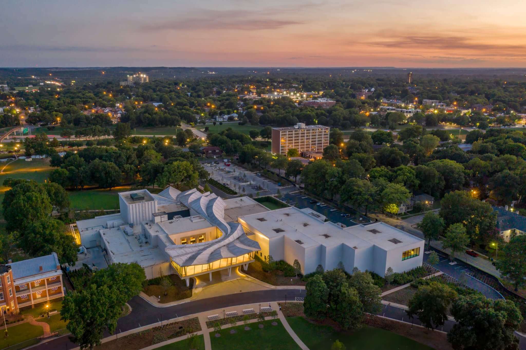 aerial view of a museum complex in a park