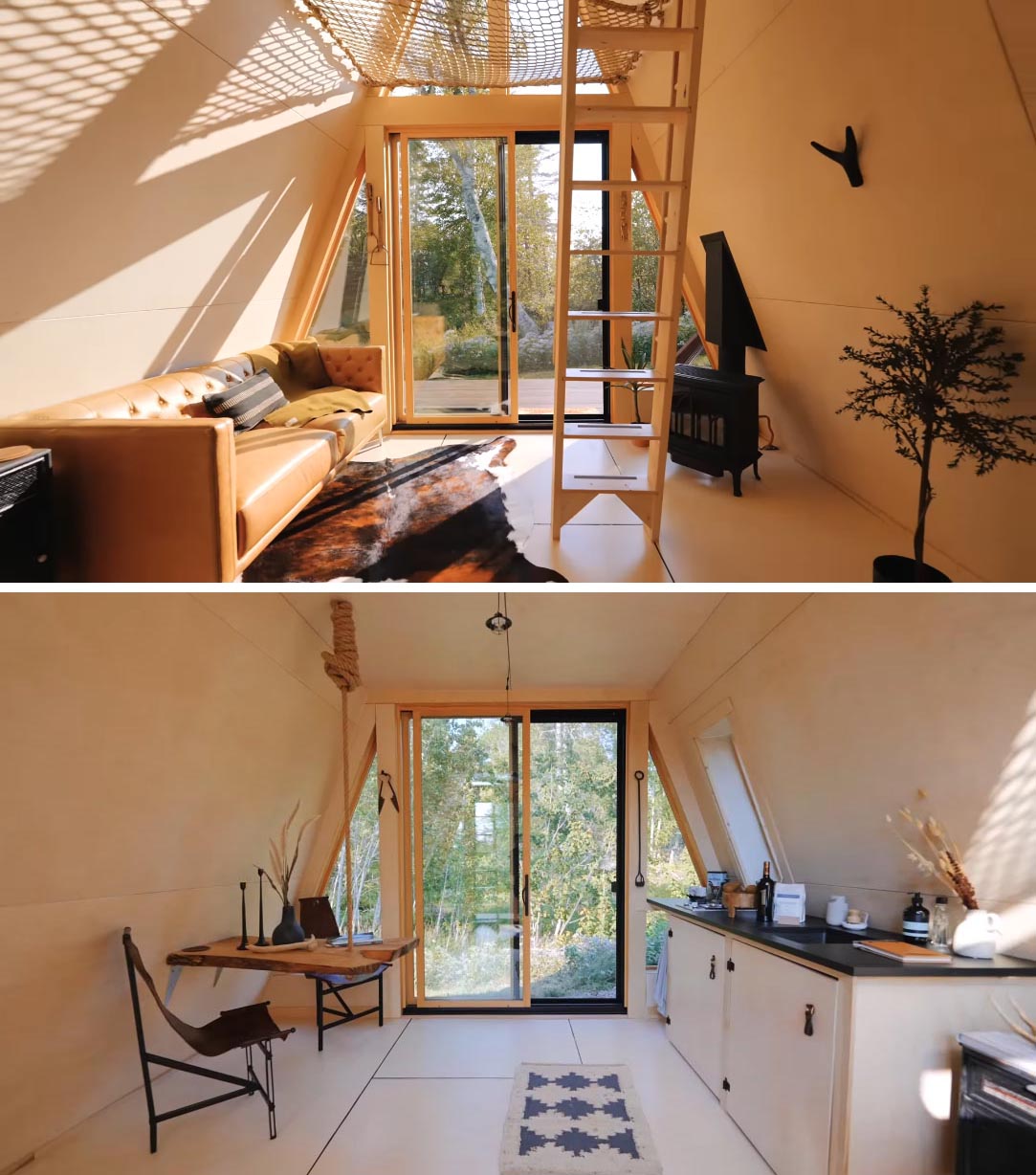 كابينة A-frame مع غرفة معيشة ومدفأة وطاولة طعام خشبية ومطبخ صغير.