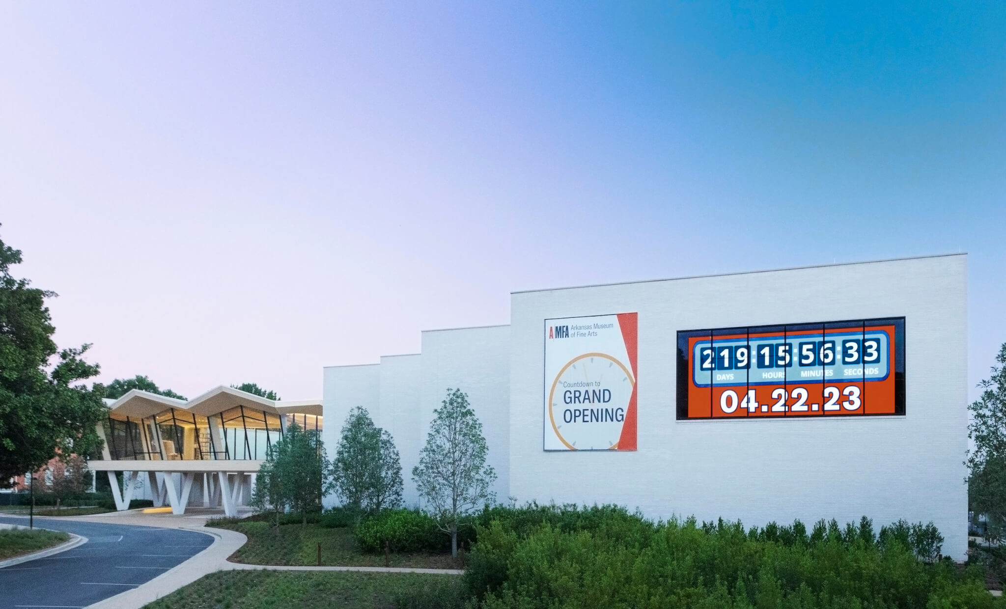 exterior of a museum complex with a large countdown clock