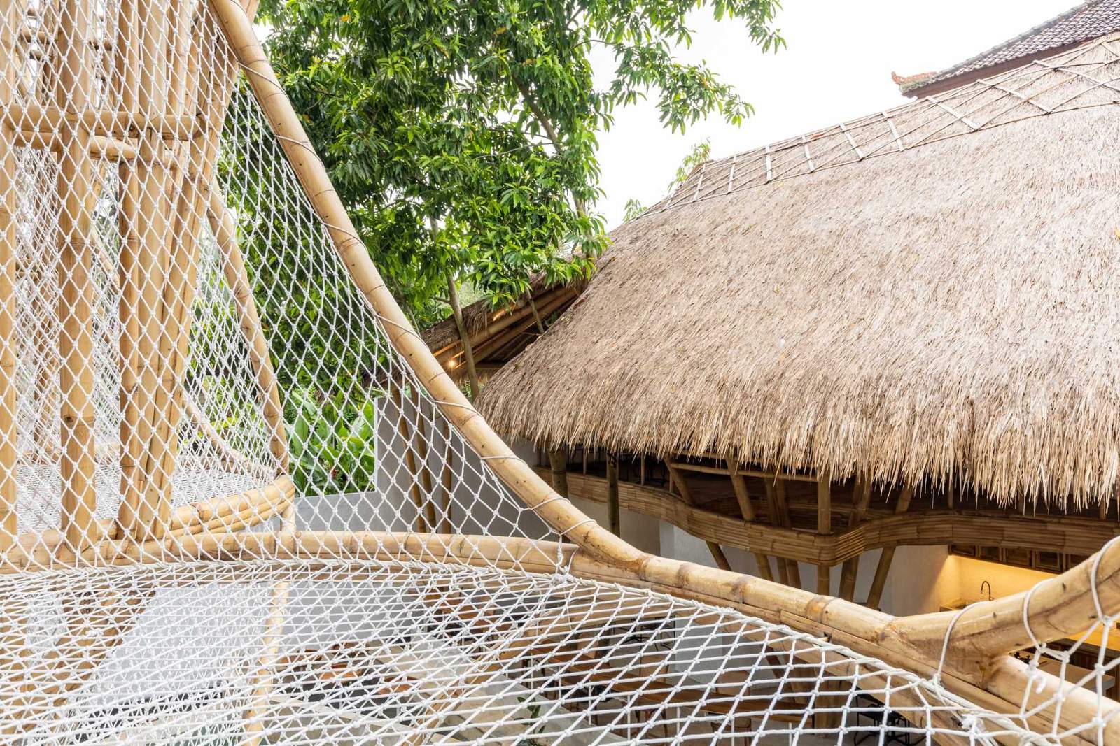 A relaxing hammock hangs off a balcony.