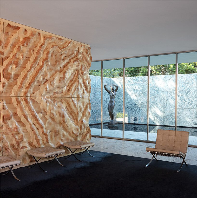 intricate timber installation 'mass is more' reinterprets mies van der rohe's barcelona pavilion