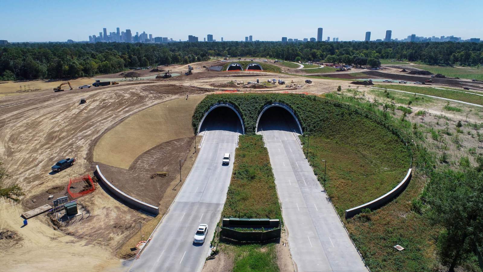 a large park with a land bridge under construction in houston