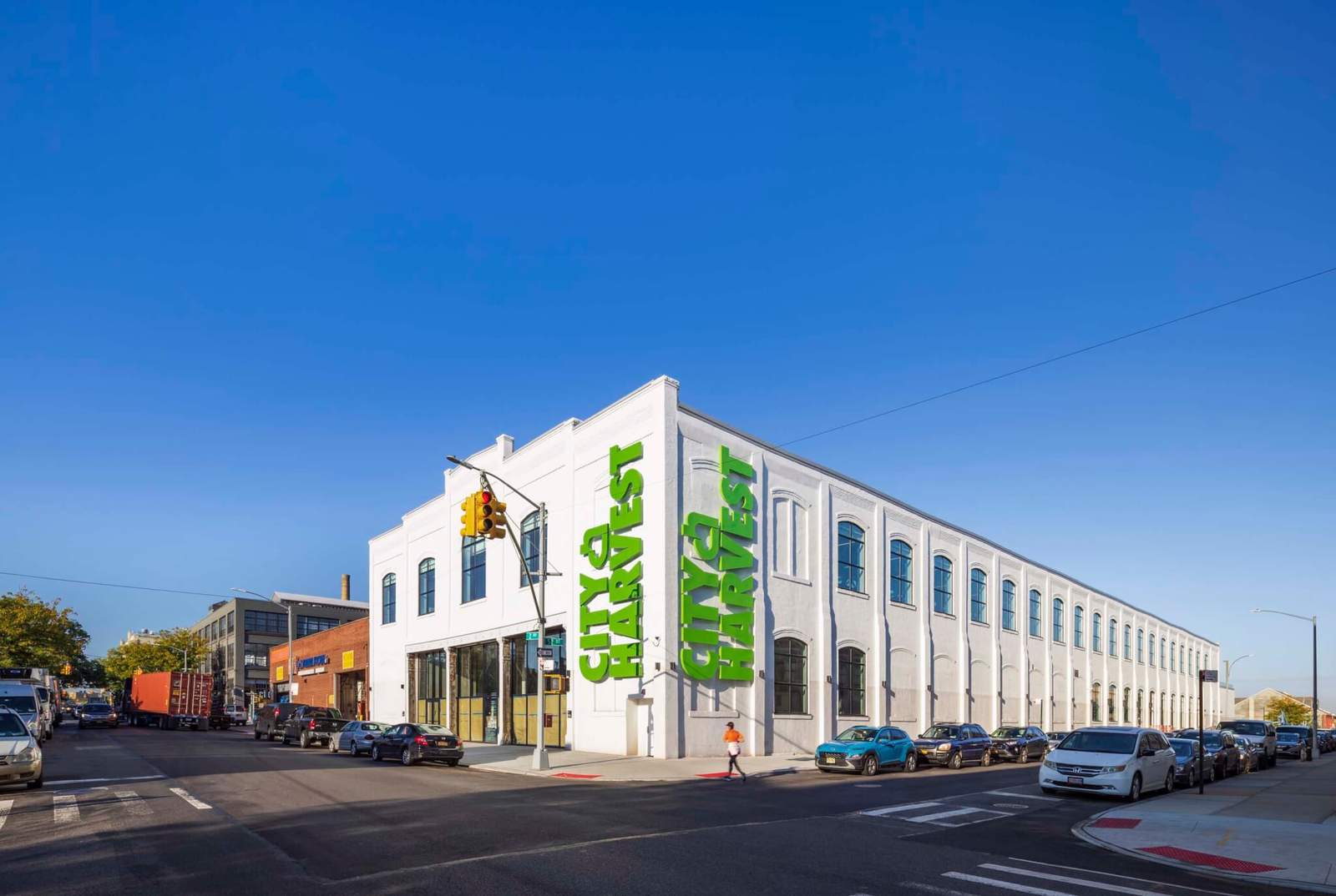 exterior of building painted white with green lettering