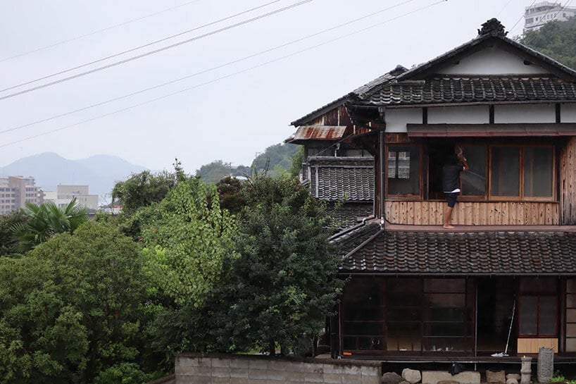 schemata architects's reconstruction project strips away old house to reveal its aged charm