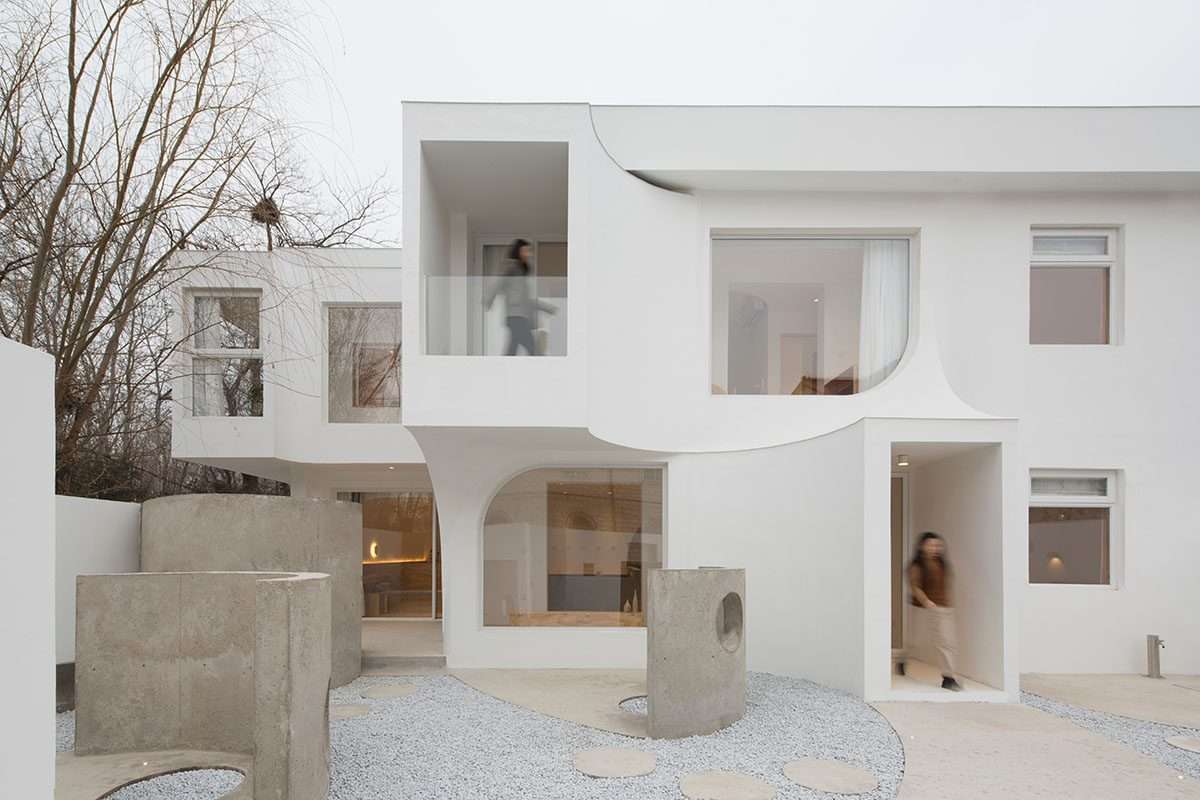 Creating a boutique hotel using flowing curves and sculptural geometric fixtures