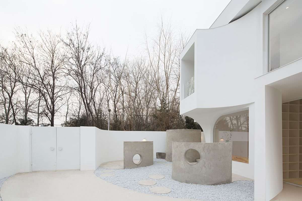 Creating a boutique hotel using flowing curves and sculptural geometric fixtures