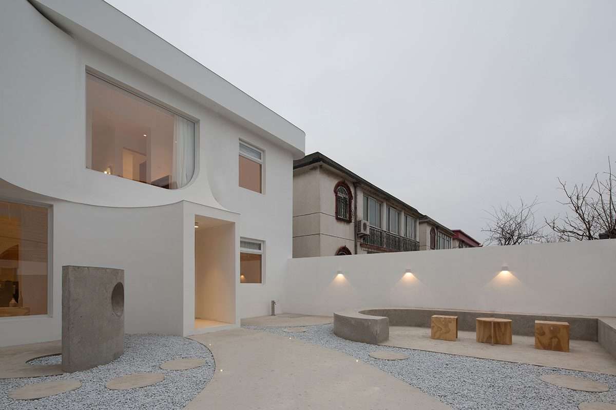 Creating a boutique hotel using flowing curves and sculptural geometric fixtures