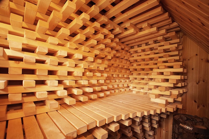 intertwined wooden beams sculpt sauna chamber by anders berensson architects in norway