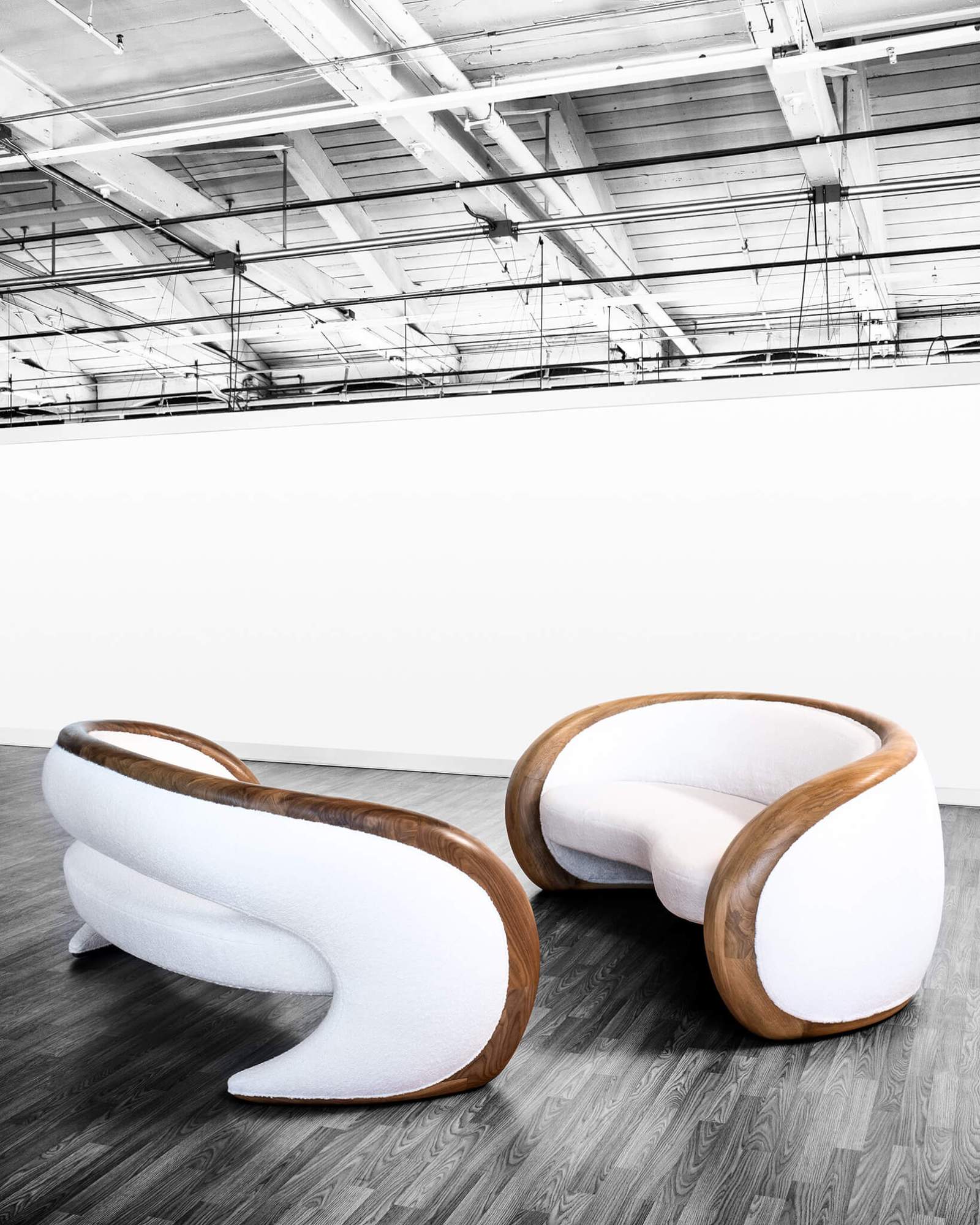 curved white sofas with wood trim