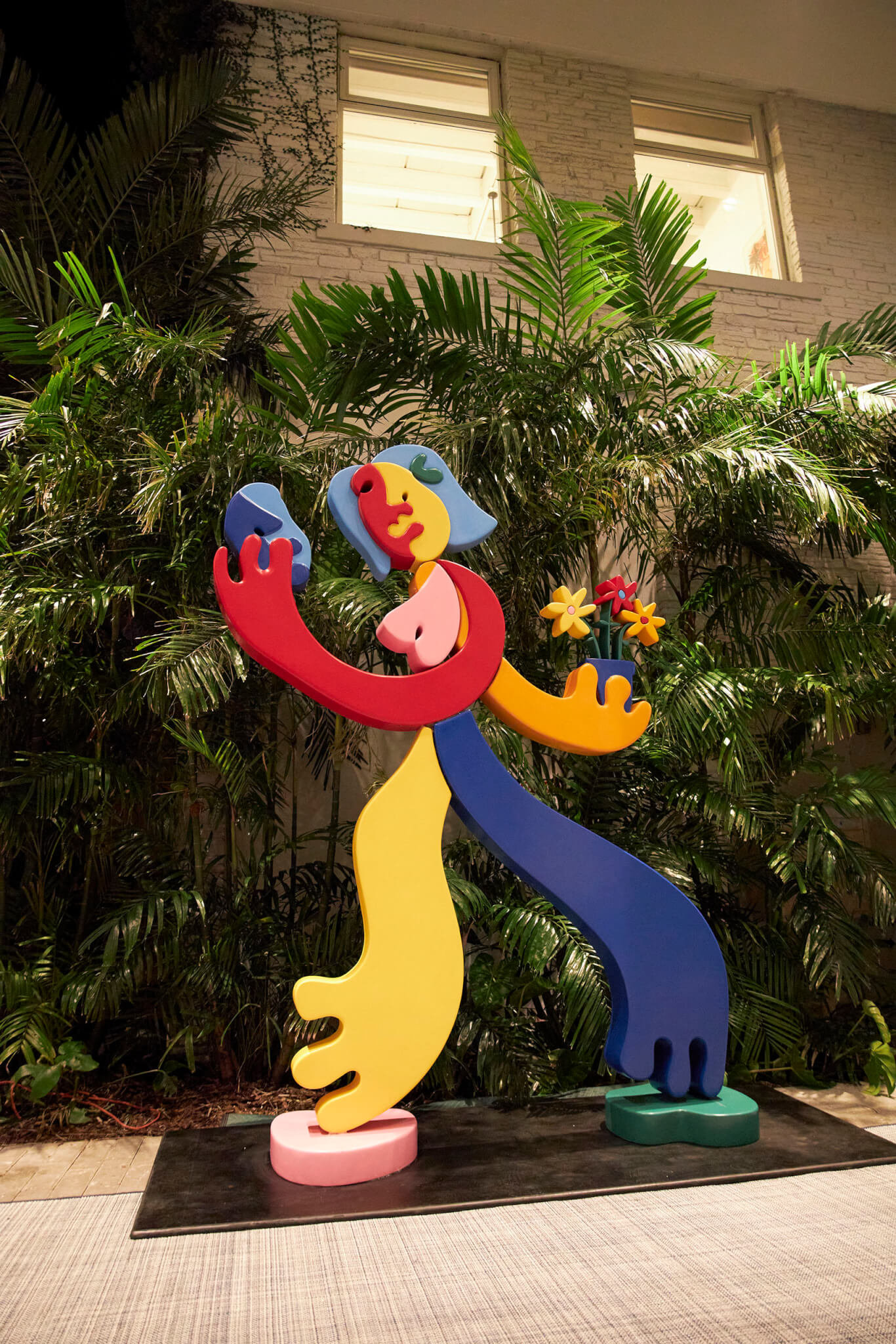 sculpture of human with each body part a different color