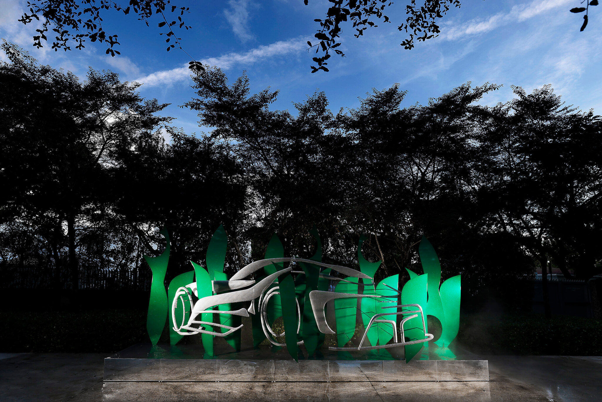 green sculpture at night