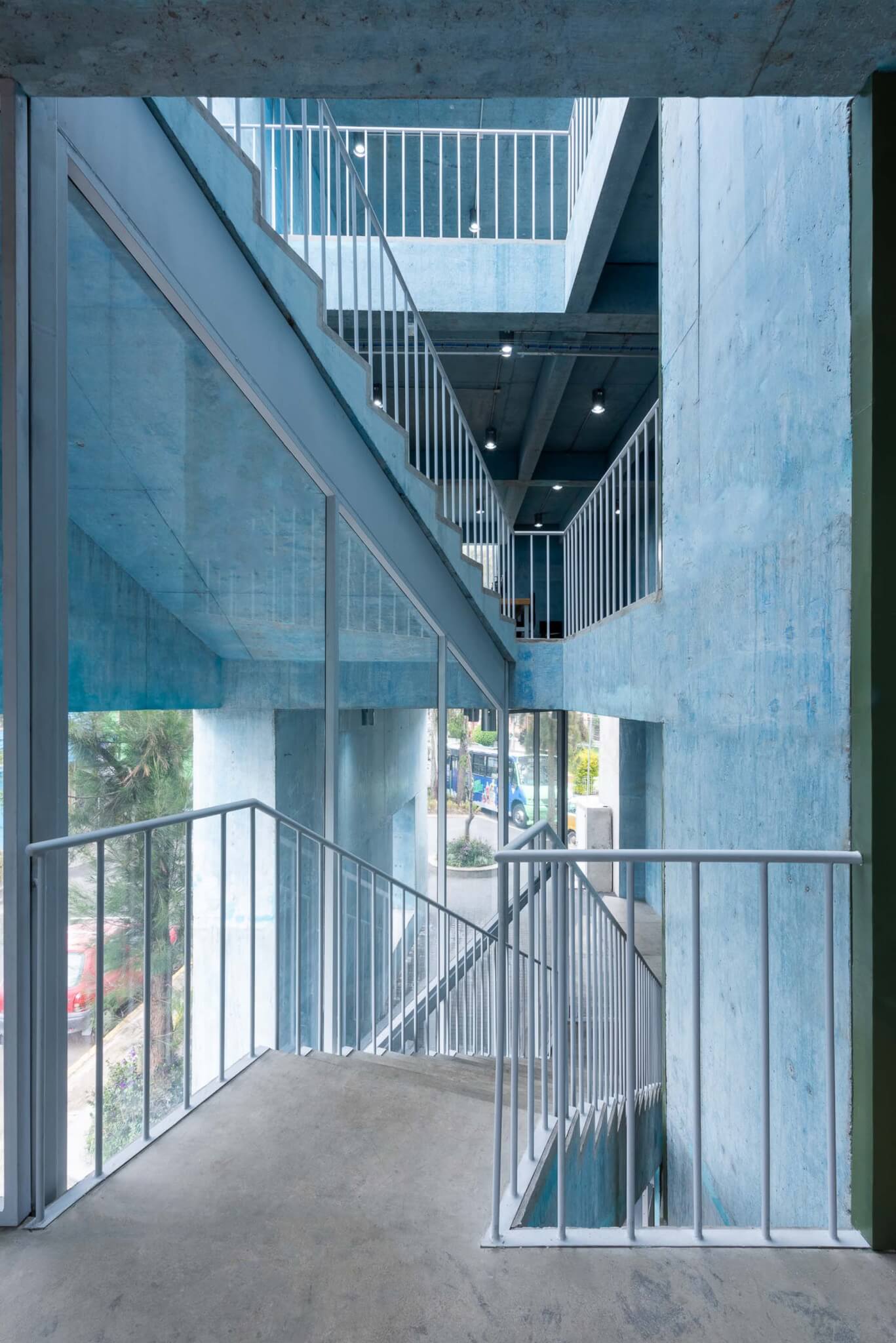 concrete staircases with metal railings