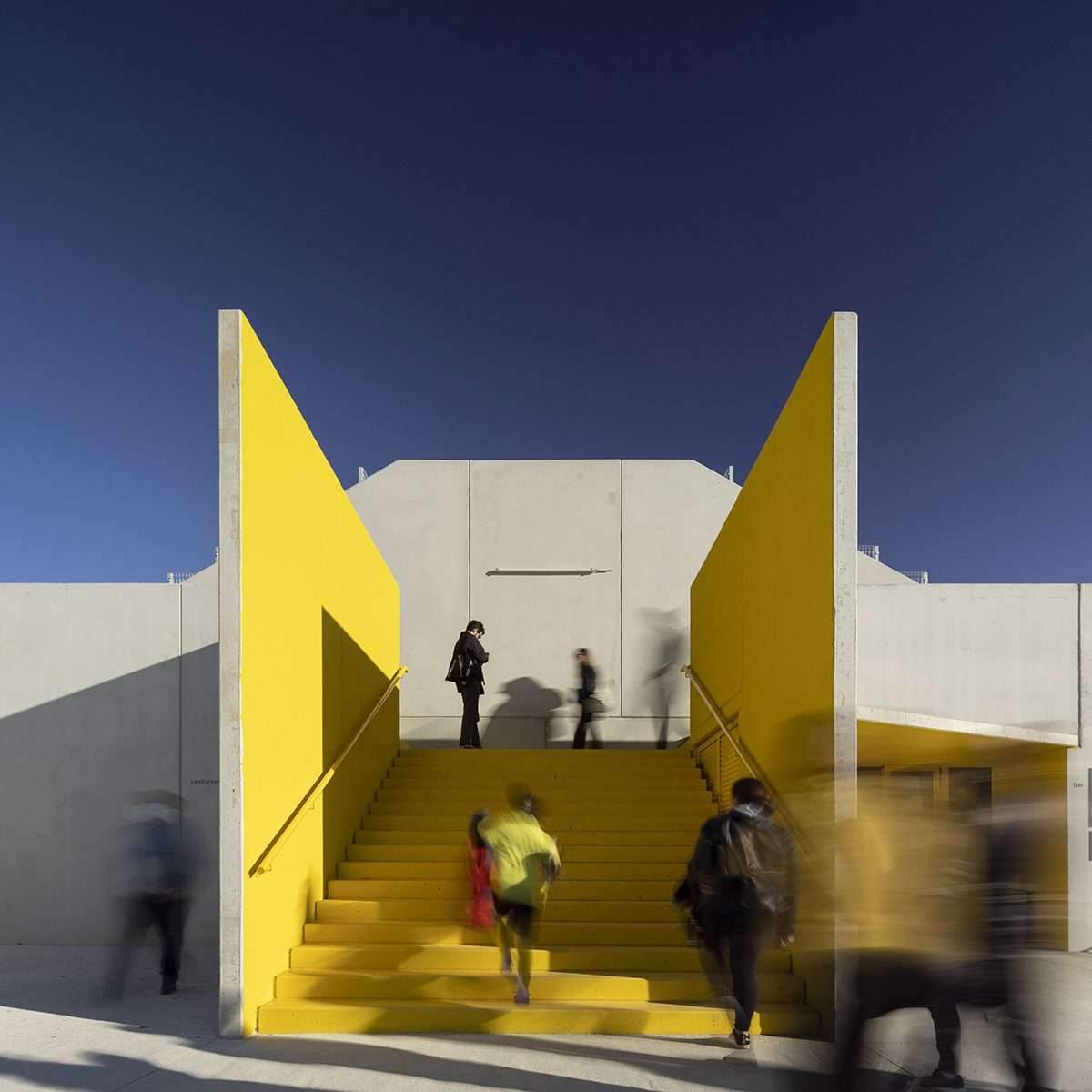 Create a summary highlighting the public spaces of the stadium's training facility in yellow