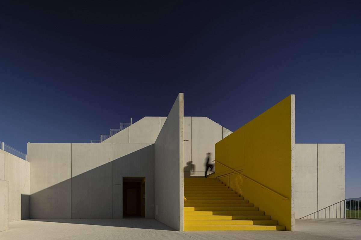 Create a summary highlighting the public spaces of the stadium's training facility in yellow