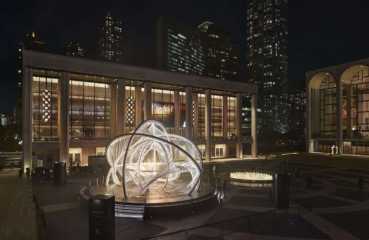 Design a kinetic sculpture representing the world's most linguistically diverse city