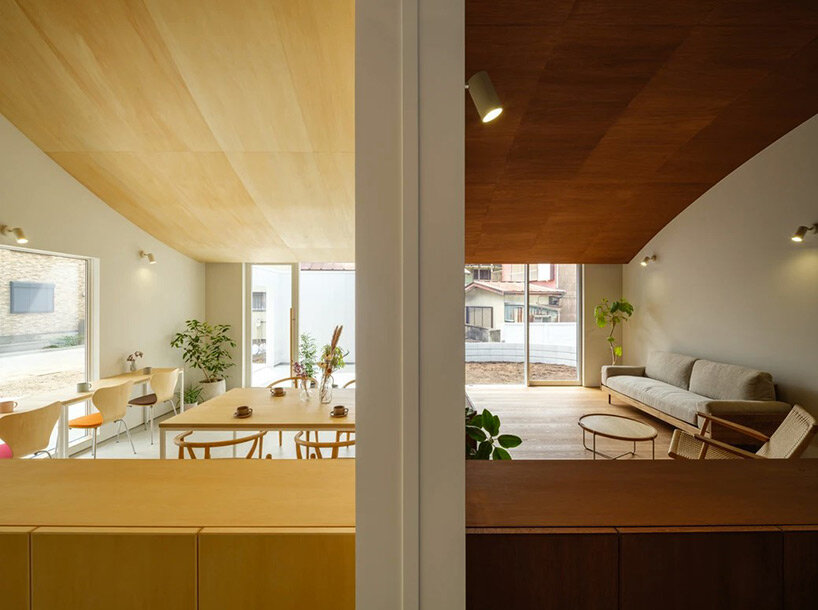 vaulted ceiling drapes over peaceful house + café by mikaduki architects in japan