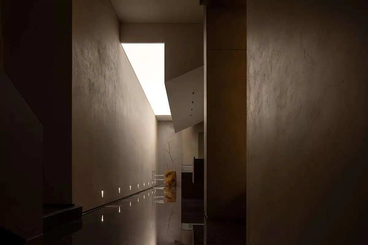 Abalone showroom design with floating blocks and golden colors