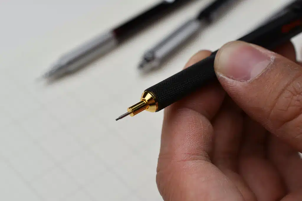 Hand holding a GraphGear 1000 vs 500 pencil focusing on the tip