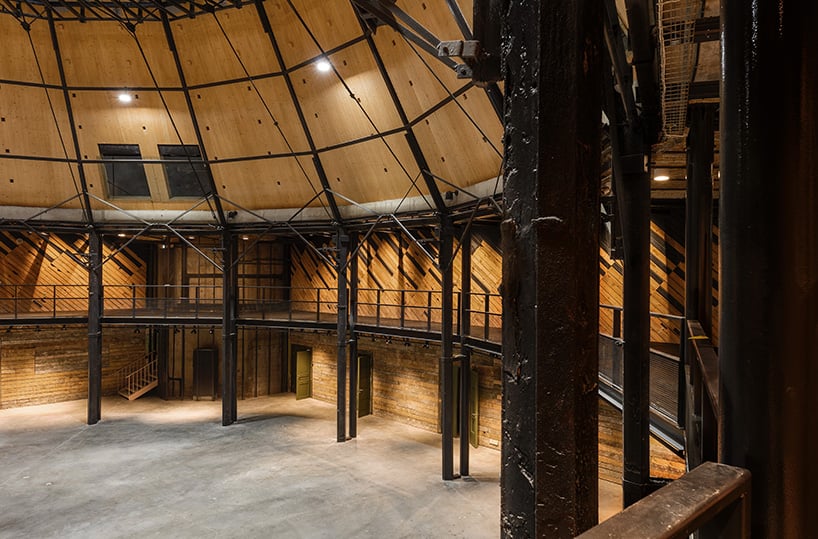 NRJA rebuilds riga's circus red dome with intertwined wooden panels