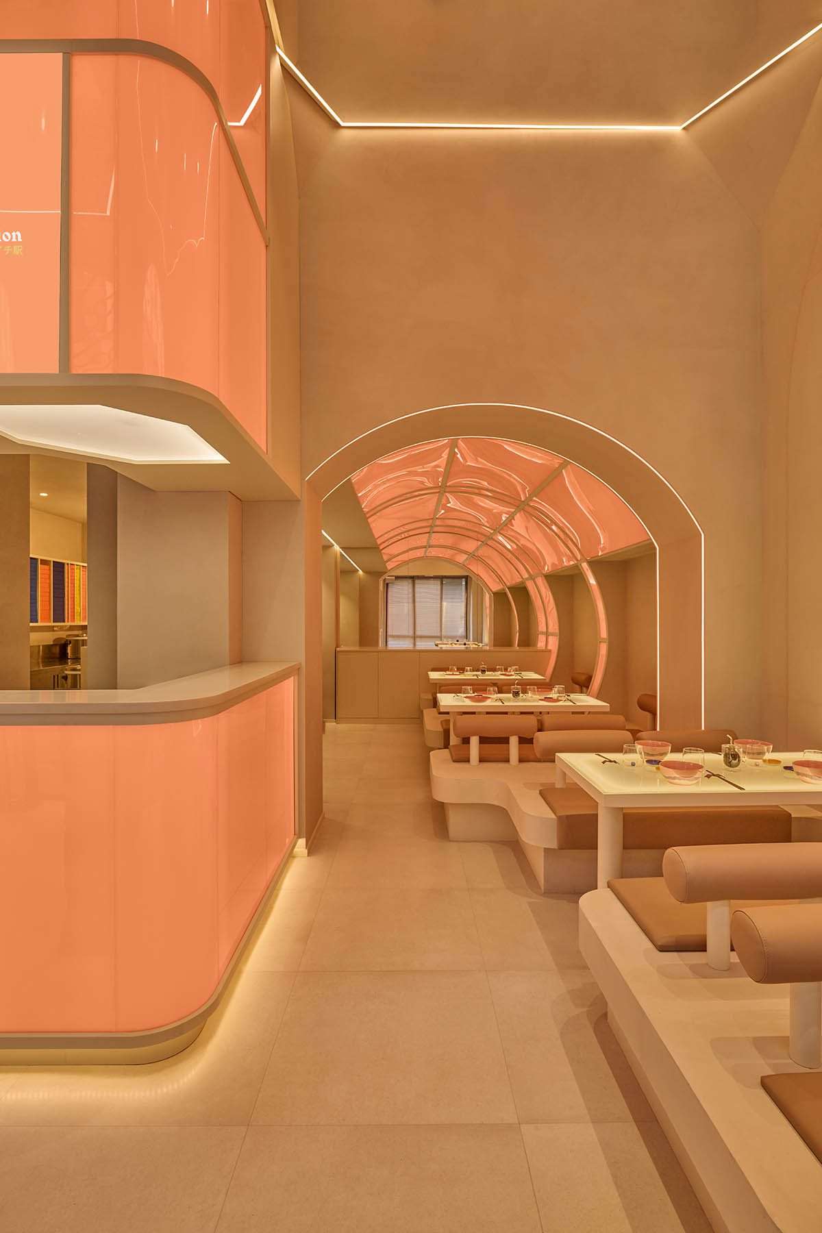 The design of the sushi restaurant in light orange colors and geometrics in Milan
