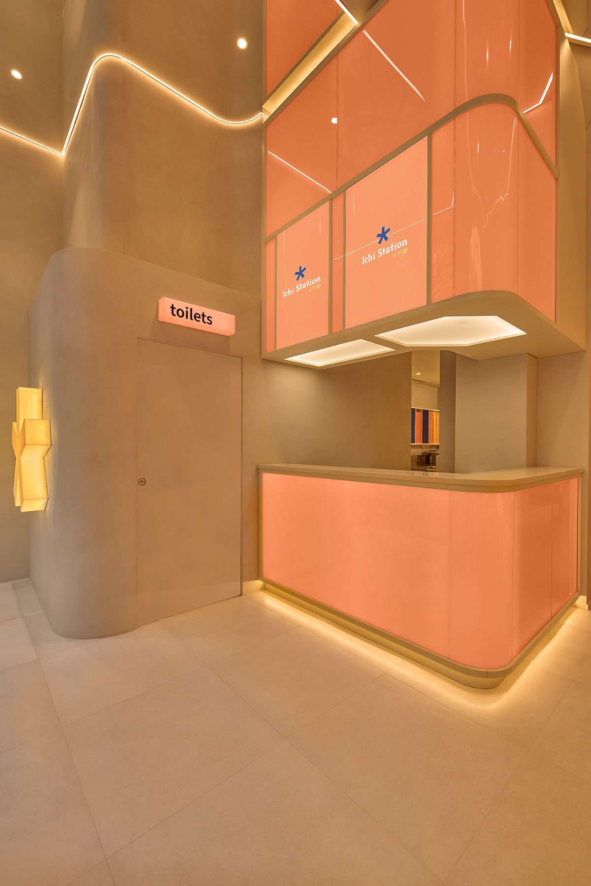 The design of the sushi restaurant in light orange colors and geometrics in Milan